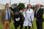 John with Finlay Carson MSP, a lady in a white coat and a cow